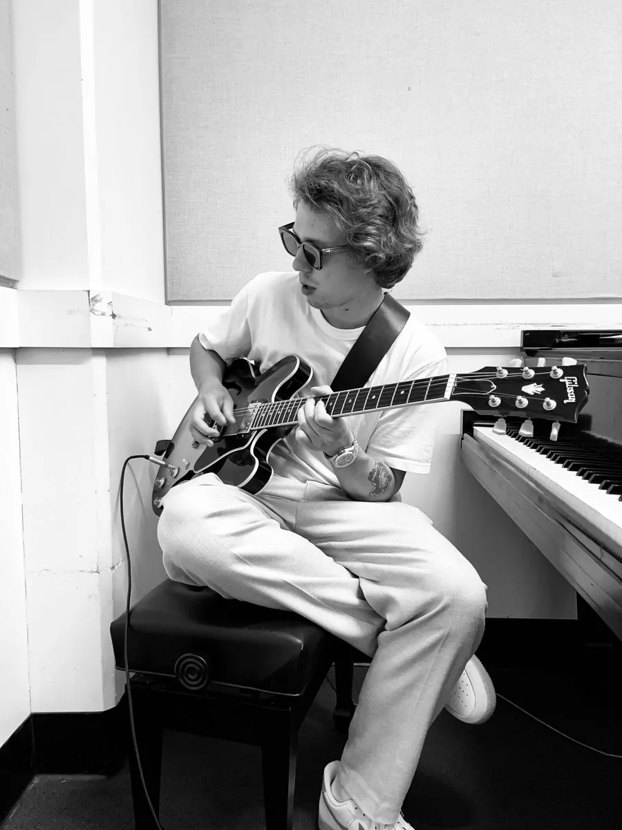 Lukas Janecek playing guitar